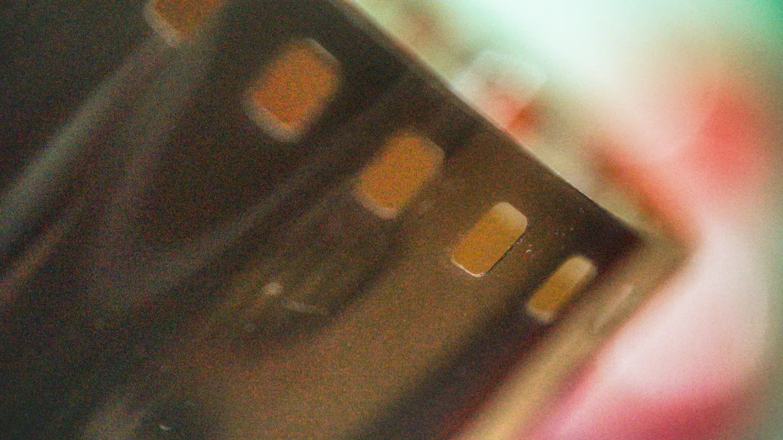 Close-up of film grain texture on a cinematic background